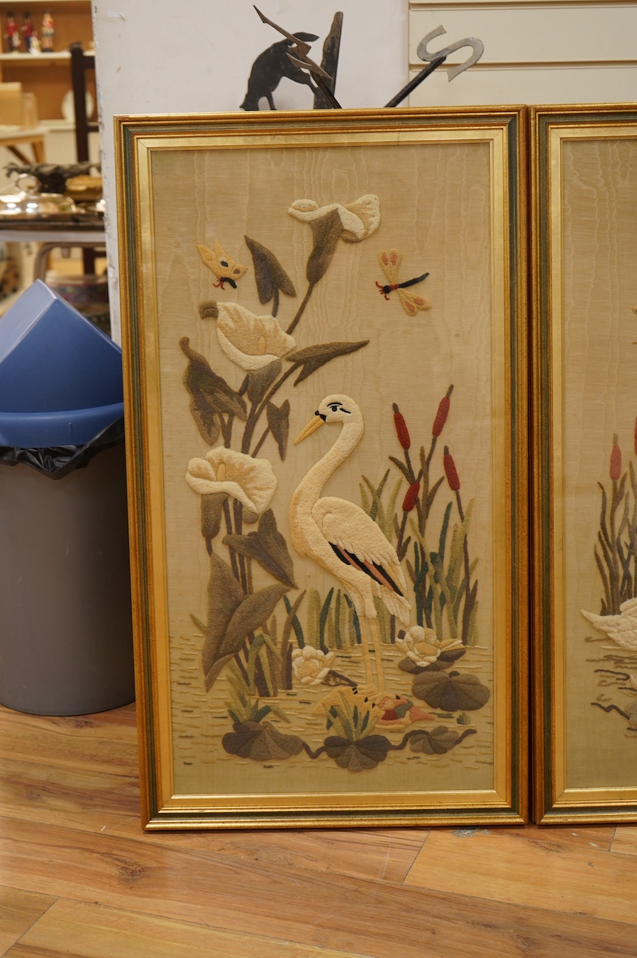 A pair of watered silk and relief felt panels, Birds amongst flowers and insects, 86 x 43cm. Condition - fair